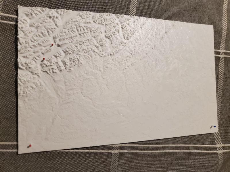 Topological map with pins on Calgary, Banff, Canmore, and Pidgeon Lake