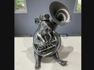 A Pig Playing a Sousaphone or Tuba