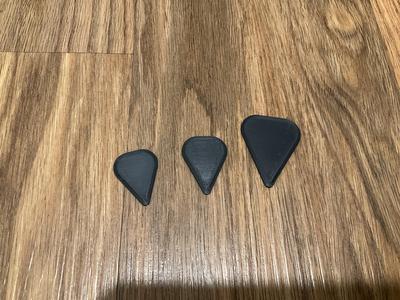 guitar pick sizes small, medium, and large.