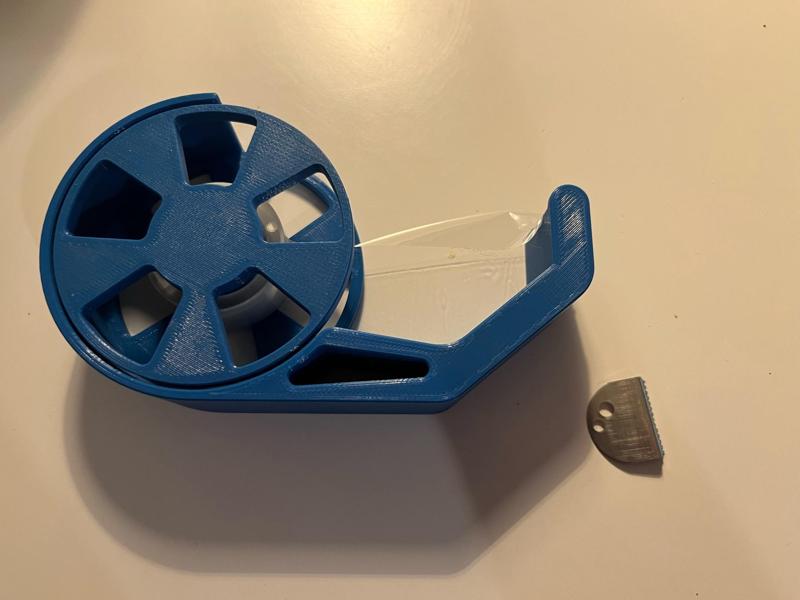 Adhesive tape dispenser