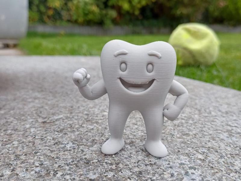 Toothy the happy tooth.
