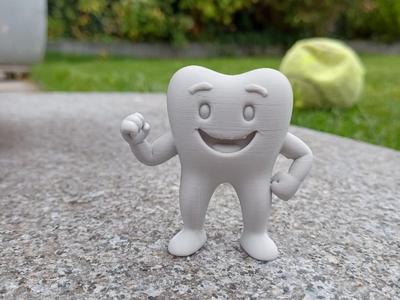 Toothy the happy tooth.