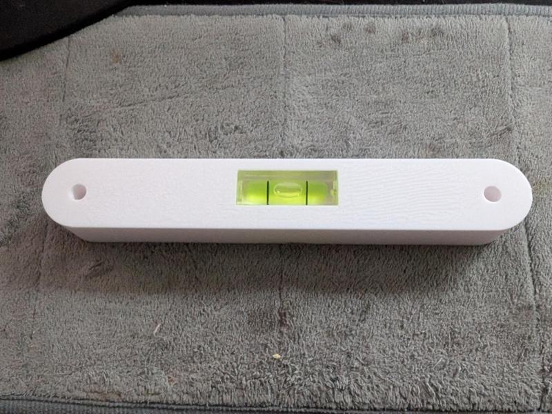 Drill helper with level to space pegboard (SKADIS)