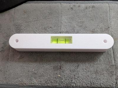 Drill helper with level to space pegboard (SKADIS)