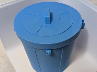 Mini trash can in the style of an outdoor trash can