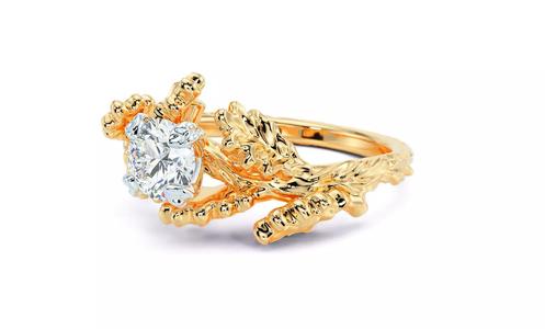 engagement gold ring oak branch with different sizes of diamonds