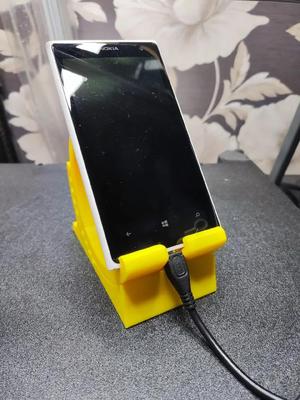 Adjustable smartphone stand with center locking   