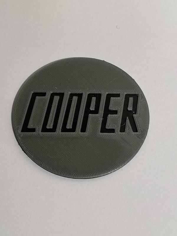 Cooper badge for wheel chock