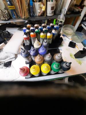Artists' paint container holders for tubes and bottles