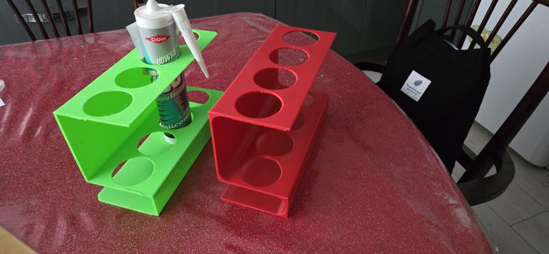 Grease/silicone tube holder