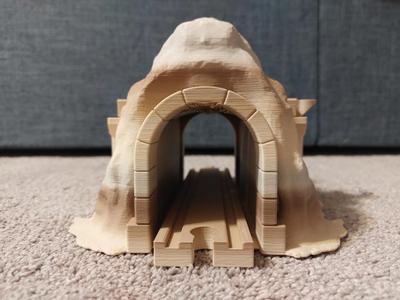 Wooden train mountain tunnel with integrated track and arched interior