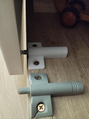 Cabinet door retarding stop holder