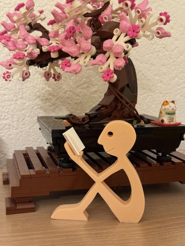 Happy thoughts (human reading a book)