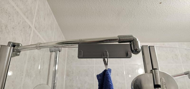 Towel hanger for glass showerwall