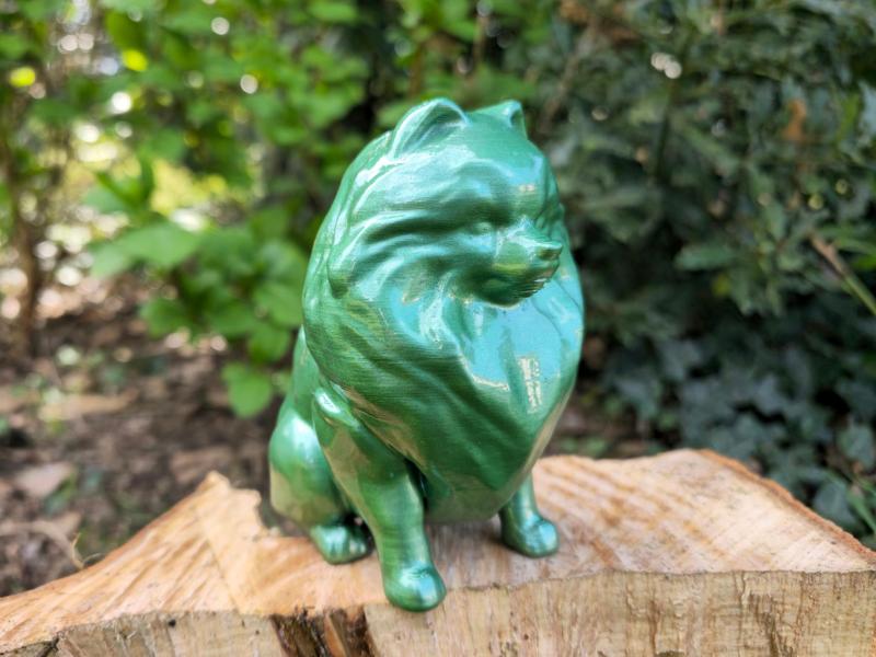 Seated Pomeranian dog sculpture