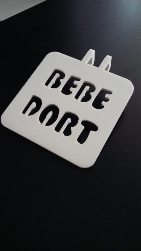 Door handle sign "Bébé dort"