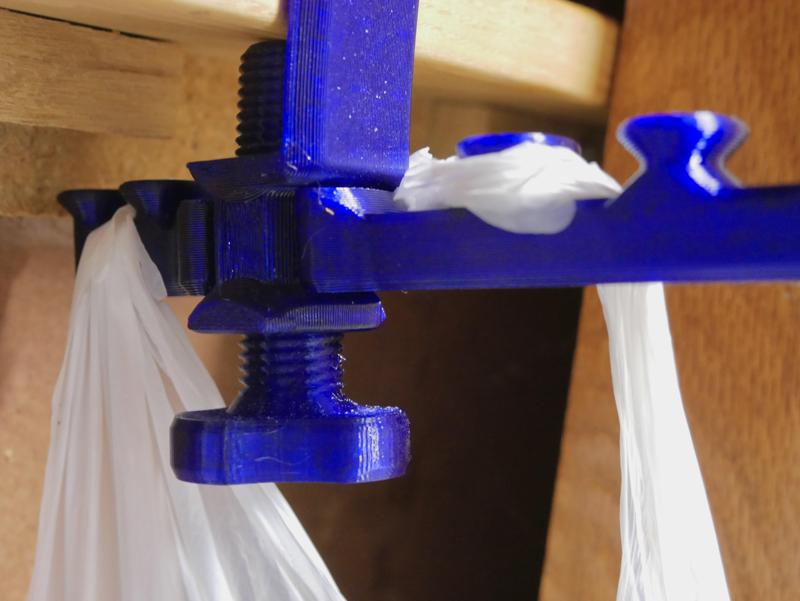 Thumbscrew for eco-friendly deskside trash bags holder