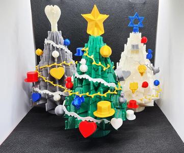 Holiday tree display with ornaments & toppers
