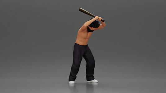gangster man with curly hair swings baseball bat with powerful intent