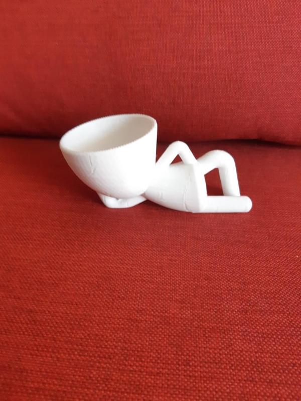 POTTED LITTLE MAN LYING DOWN PRICKLY PEARS, SUCCULENTS, PLANTS