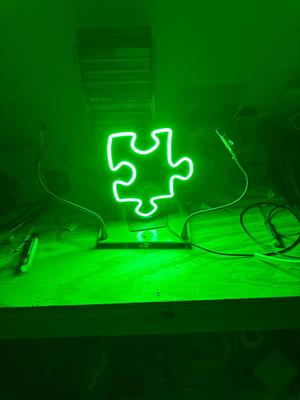 Neon Puzzle Piece Sign