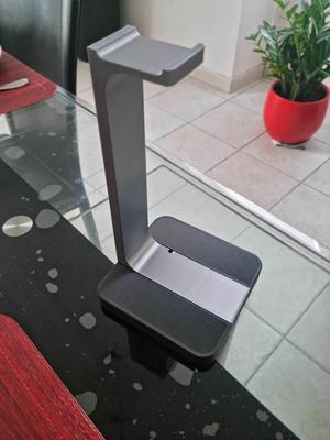 Headset holder with charging cable passage