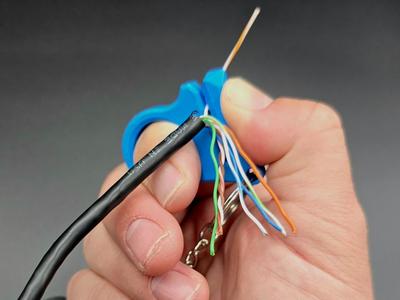 Keychain Thumb Saver - Straightener for CAT Cable