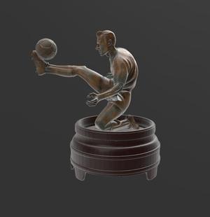 SOCCER PLAYER AND BALL SCULPTURE