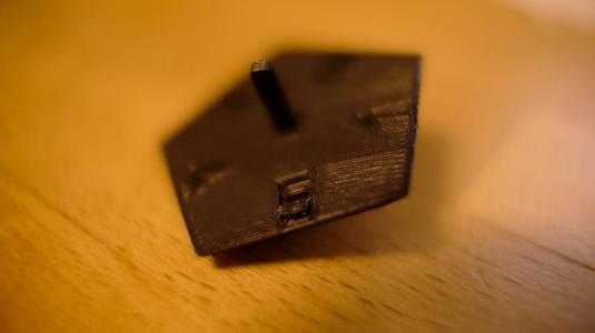 Customizable Spinning top and dice replacement