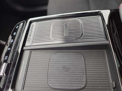 Tucson 2025, cover cup holders. Passenger phone support, if you don't use cup holders
