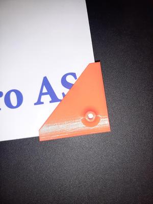 Template for drilling holes in the corner of a plate.