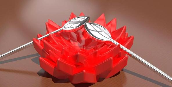 A teaspoon and teabag holder