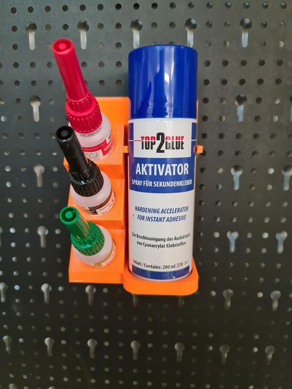 Adhesive holder for key hole wall