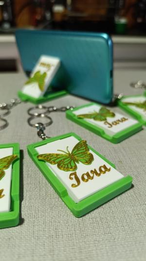 Keychain with cell phone holder function