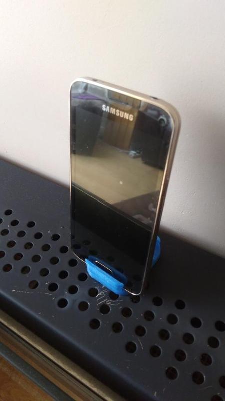 Mobile phone holder with pen holder