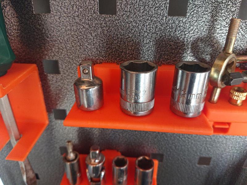 Pegboard with middle sleeve hook