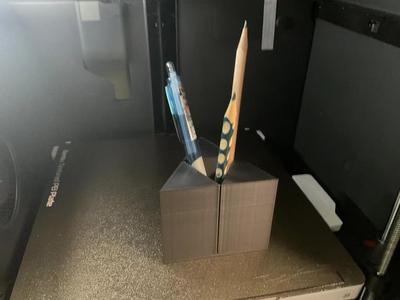 The triangle power pen holder