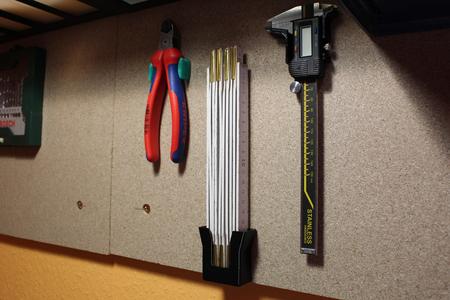 Metric folding rule wall mount