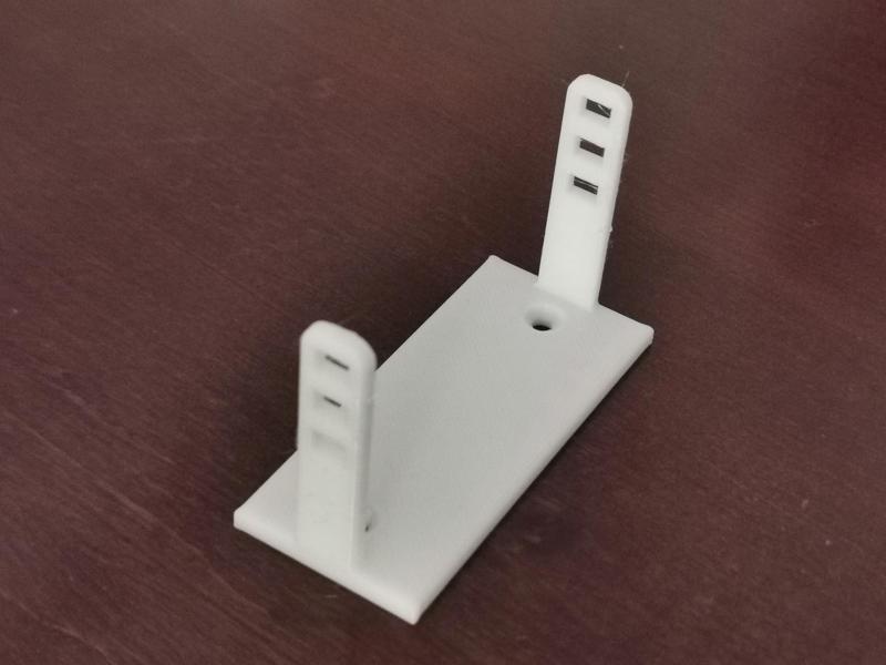 Desk cable organizer. Extension cord mount.