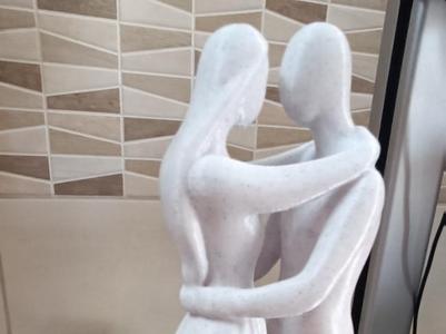 embracing statue love