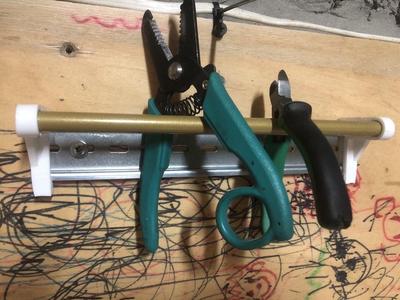 Pliers holder for DIN rail