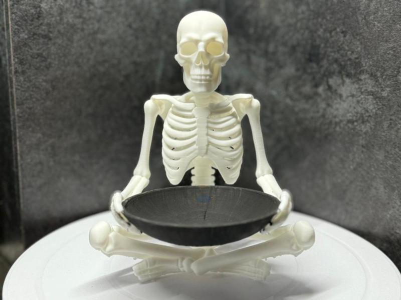 skeleton with a candy bowl
