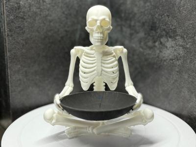 skeleton with a candy bowl