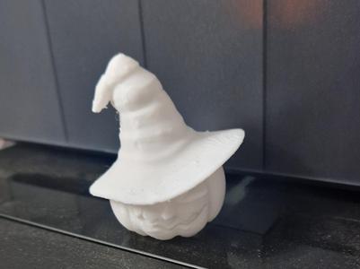 Halloween pumpkin with witch hat