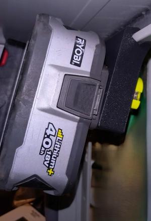 Ryobi battery holder under the steel shelves