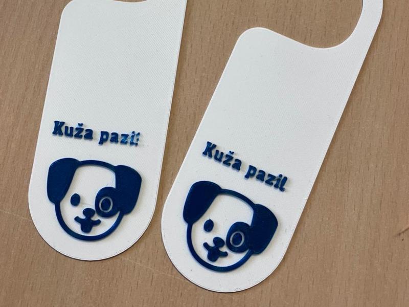 Dog watches door hanger