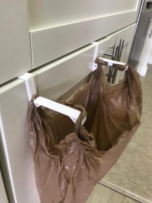 Grocery bag trash hanger for cabinets