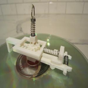 CD gripper for a CD changer