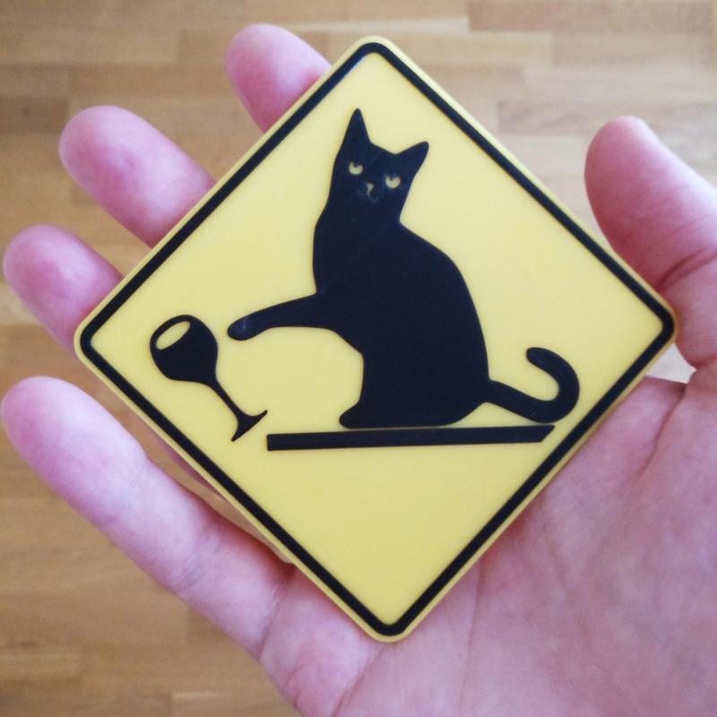 Cat knocking down stuff warning sign