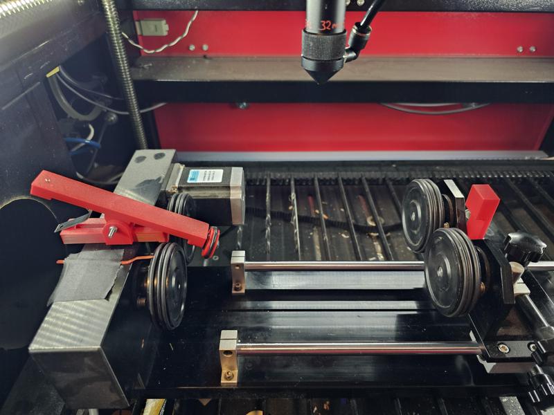 Rotary laser hold down